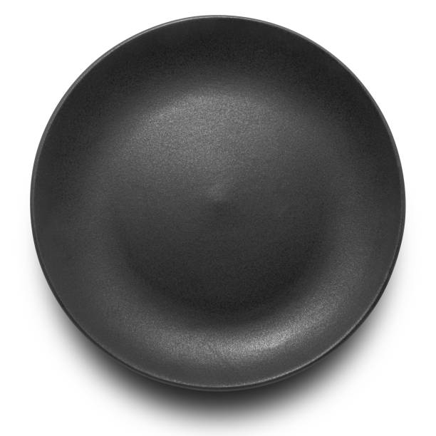 Black circle ceramics plate isolated on white background.