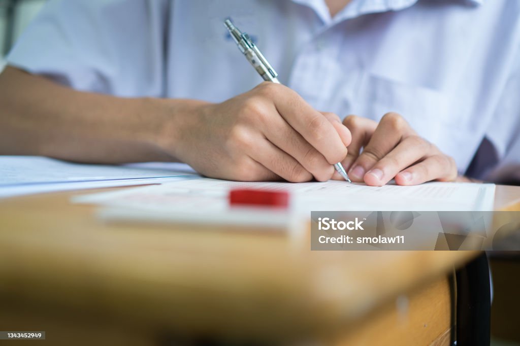 Student Writing In Exam Writing Test In Exam Asian Students Concentrate In High School Serious ...
