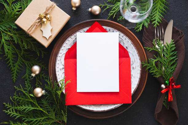 istock Christmas table setting with mockup of greeting card or invitation. 1343455807