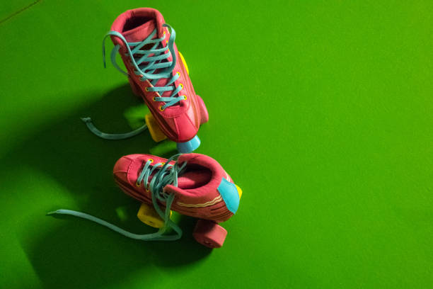 istock Colorful Roller Skates on Green Background 1343456684