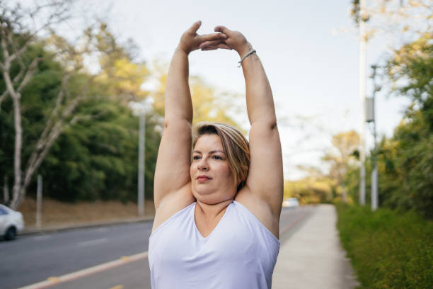 istock Woman stretching in city park 1343458185