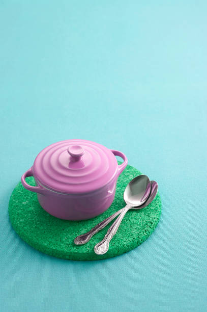 istock Stainless spoon and ceramic cup on pastel background 1343458297