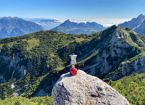 Moka coffee on portable camping stove on top of the mountain