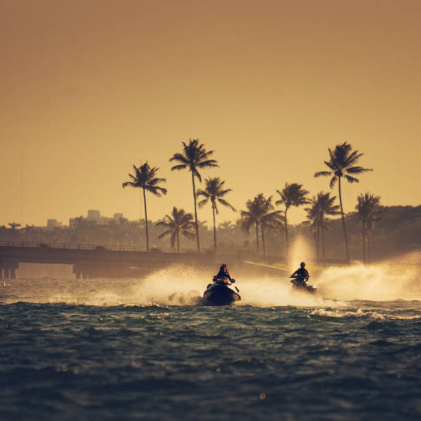 jet-skis in den haulover inlet in miami - yacht florida yachting nautical vessel stock-fotos und bilder