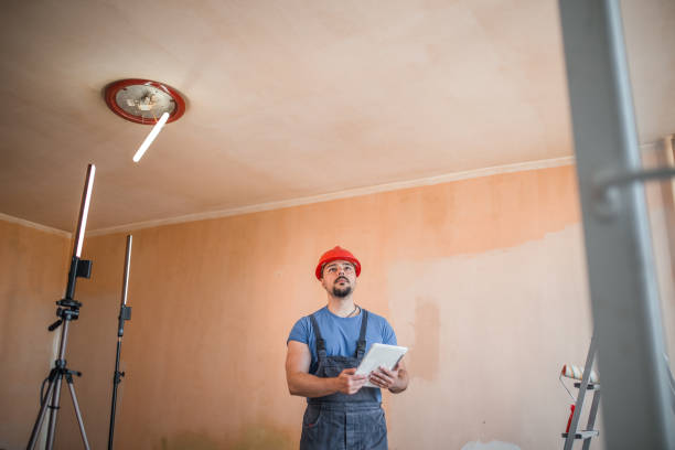 istock Concentrated worker thinking how to paint the room 1343463838