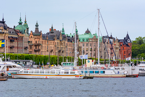 Stockholm, Sweden - June 2019: Ships and boats along Strandvagen embankment