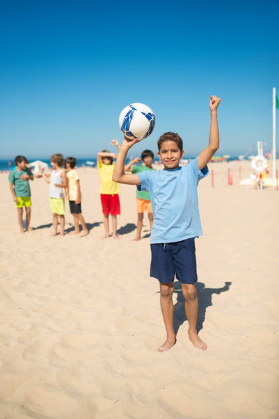 istock Happy African American boy with ball over head 1343466499