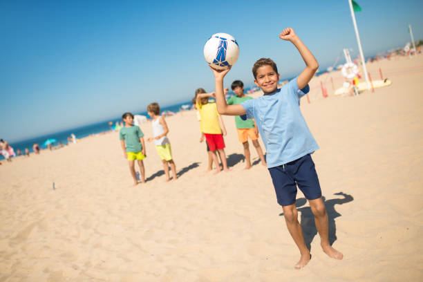 istock Happy African American boy cheering with ball 1343466694