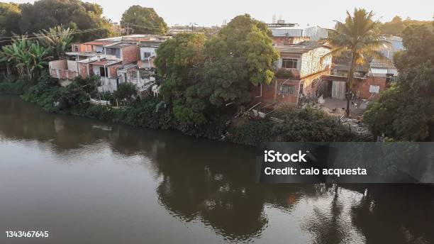 Mighty Paraiba Do Sul River In Volta Redonda Rio De Janeiro Brazil Houses On The Banks Of The Polluted River Stock Photo - Download Image Now
