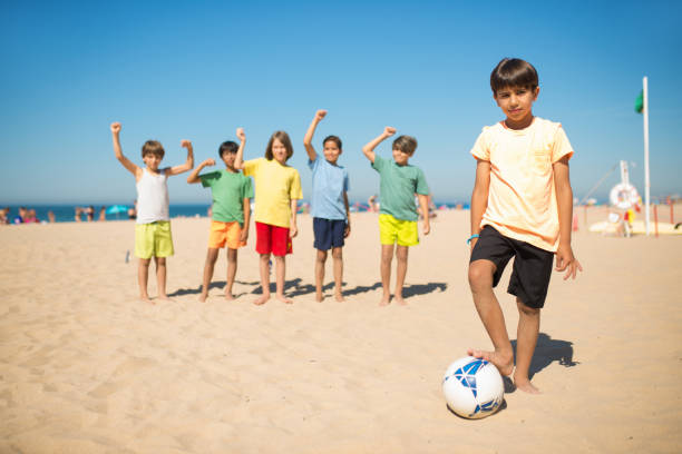 istock Confident Arabic boy standing with soccer ball 1343467944