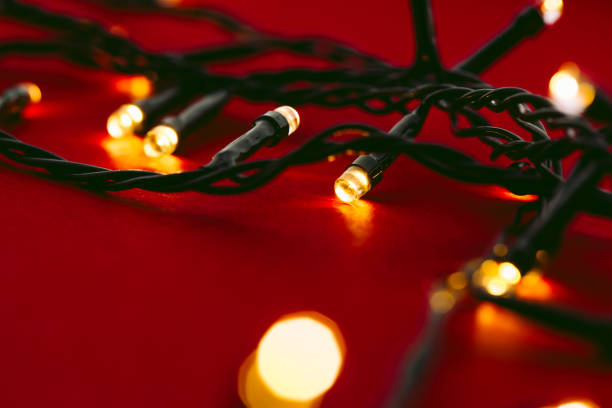 istock Red background with illuminated lights of garland 1343468057