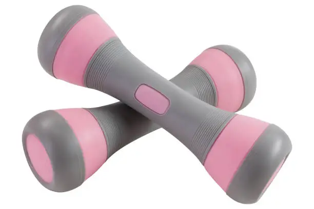 Photo of a pair of gray dumbbells with pink inserts, lie one on top of the other, on a white background