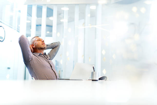 istock Relaxed male entrepreneur taking a break in the office. 1343472915