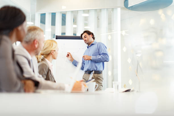 istock CEO giving a presentation to his team in the office. 1343472984