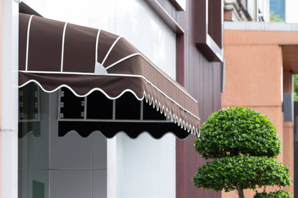 brown awning over entrance window.