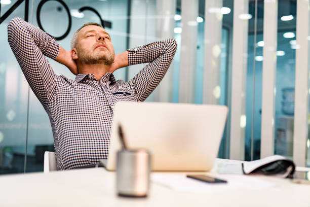istock Tired businessman taking a break in the office. 1343473216