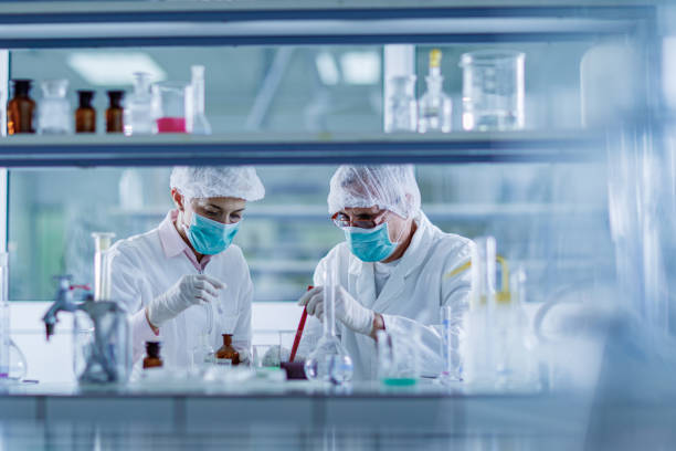istock Senior chemists working on poisonous liquid in a laboratory. 1343477468