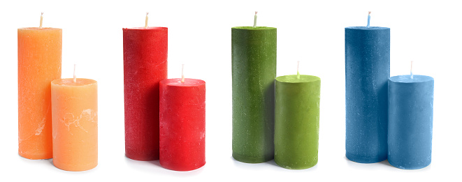 Set of color wax candles on white background. Banner design