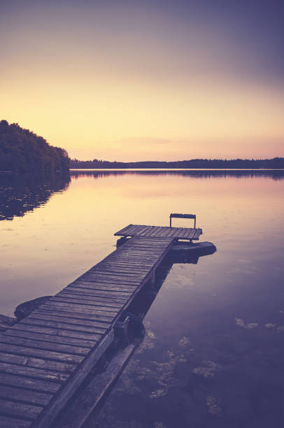 istock Wooden lake pier at sunset. 1343479149