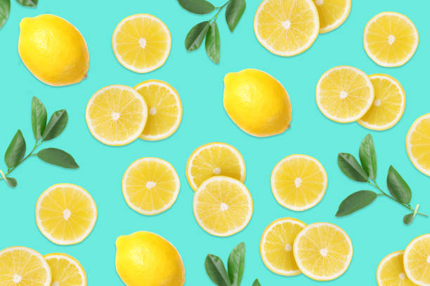 istock Flat lay composition with lemons and leaves on aquamarine blue background 1343480383