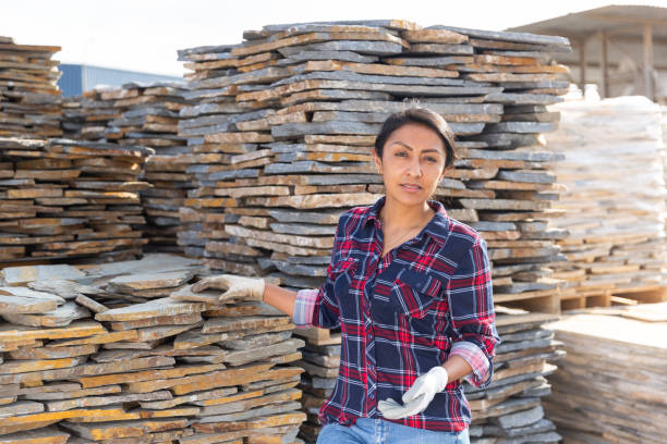istock Hispanic woman worker posing with natural stone tile 1343482175