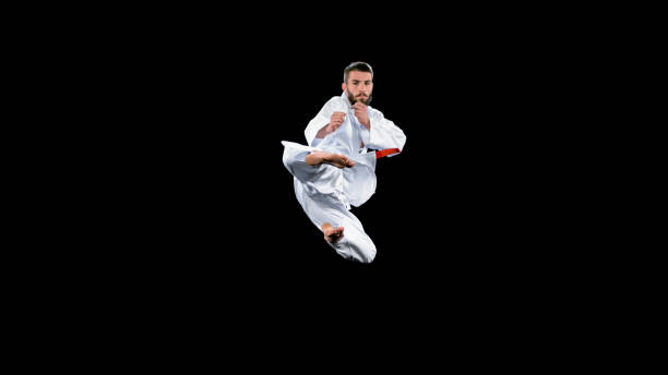 istock Male karate player performing a flying kick 1343482300