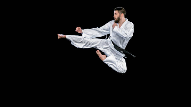 istock Male karate player performing a flying kick 1343482306