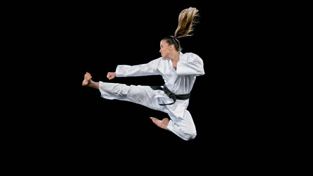 istock Female karate player performing a flying kick 1343482309
