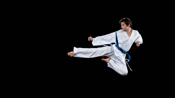 istock Male karate player performing a flying kick 1343482313