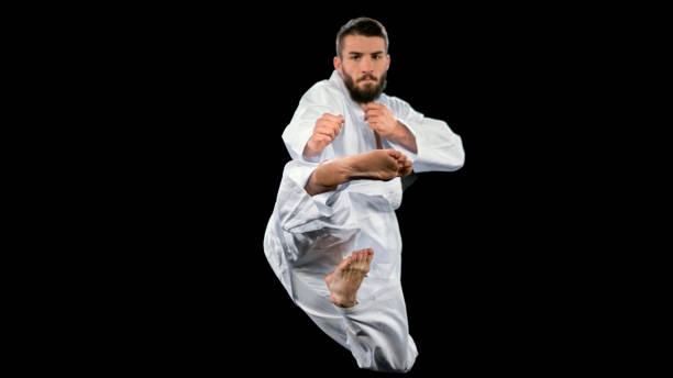istock Male karate player performing a flying kick 1343482323