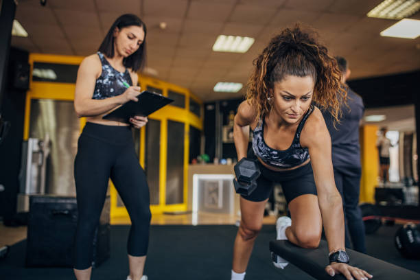 istock Personal trainer watching a woman train 1343484627
