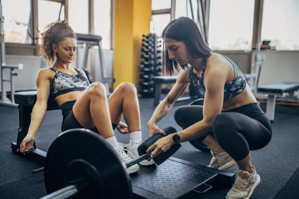 istock Woman training with fitness trainer 1343487443