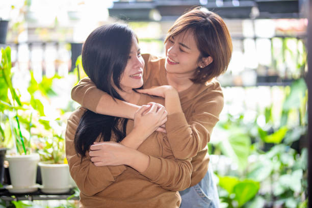 istock Happy Friends Standing Against Blurred Background 1343487525