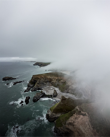 A low level fog rolling in from the coastline covers the area around portreath.