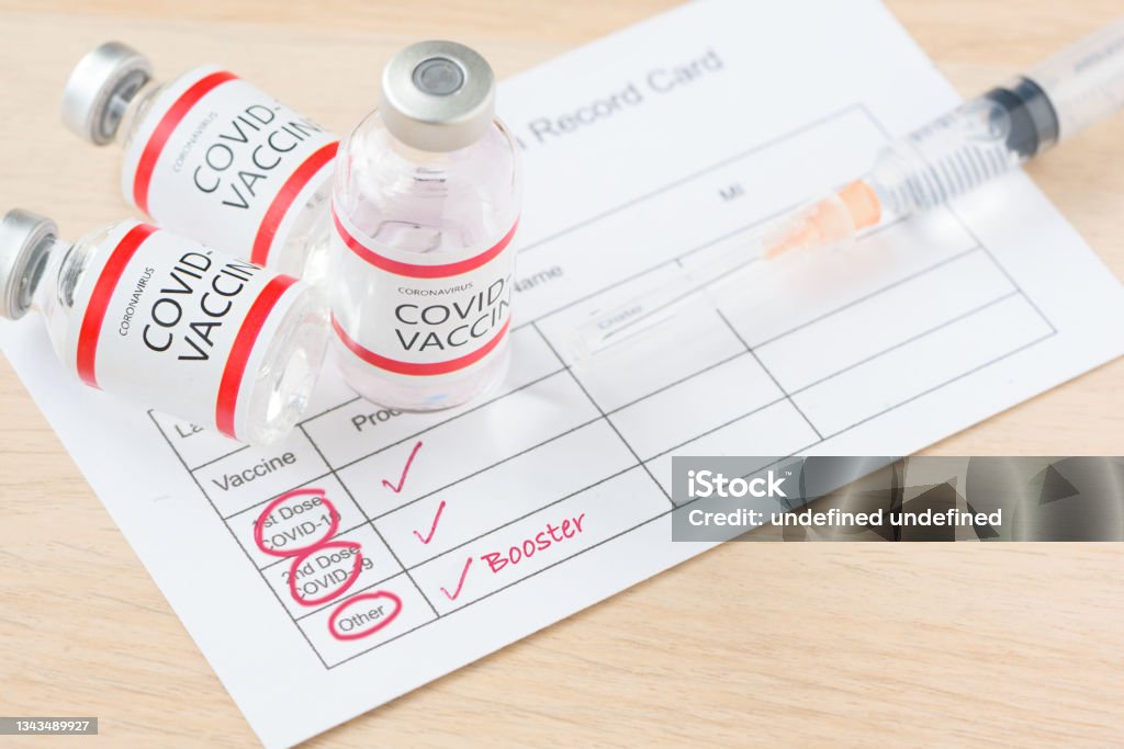 Booster dose of covid-19 vaccine Vaccination record card showing booster dose of covid-19 vaccine. The thrid vaccination for immunity against delta variant. Booster Dose Stock Photo