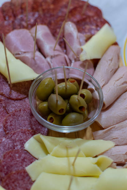 istock Assorted  food, snacks and appetizers, before main meal, beautifully decorated, cheese, olives, smoked ham, for party. 1343490534