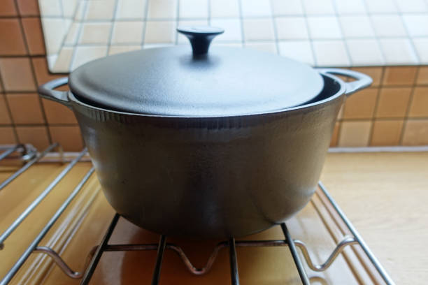 Cast iron casserole dish on a gas hob  Cooking