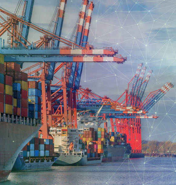istock Container cargo freight ship with crane and dynamic icons. View of the container terminal, loading and unloading of various shipping container with future icons. A seaport on the river Elbe in Hamburg 1343490761