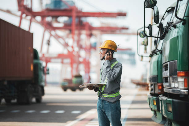 istock Worker using walkie-talkie in commercial dock 1343491762