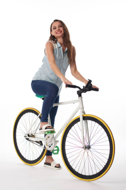 istock Young Pretty Woman Riding Bicycle 1343493145