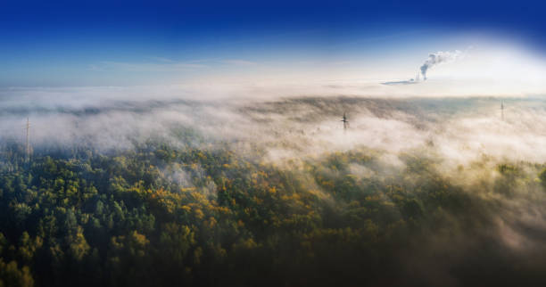 nature and industry - misty landscape from above with you on the power station stock photo