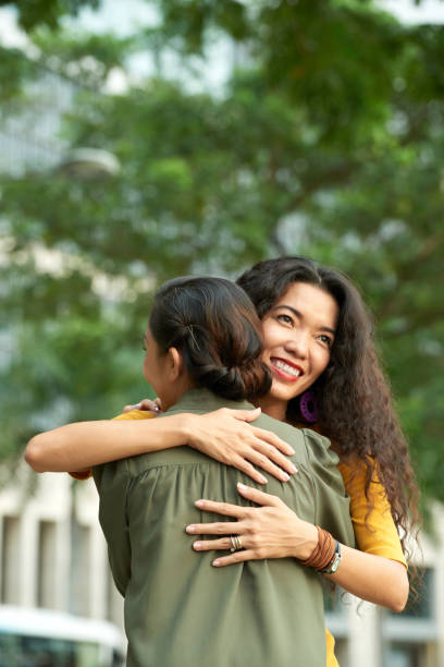 istock Daughter Hugging Mother In Park 1343496430
