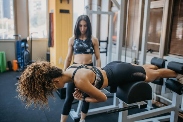 istock Fitness trainer watching a woman in practice 1343499803