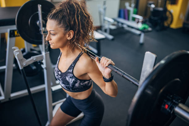 istock Woman exercising with weights 1343500174
