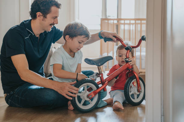 istock Father fixing a bike at home 1343501801