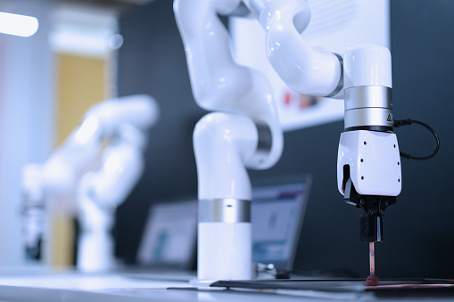 Robot manipulator on table in industrial technical testing laboratory closeup. Modern technologies concept