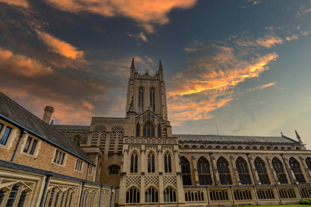 Bury St Edmunds cathedral under moody sky in Suffolk View looking up at the impressive St Edmundsbury cathedral in Bury St Edmunds bury st edmunds stock pictures, royalty-free photos & images