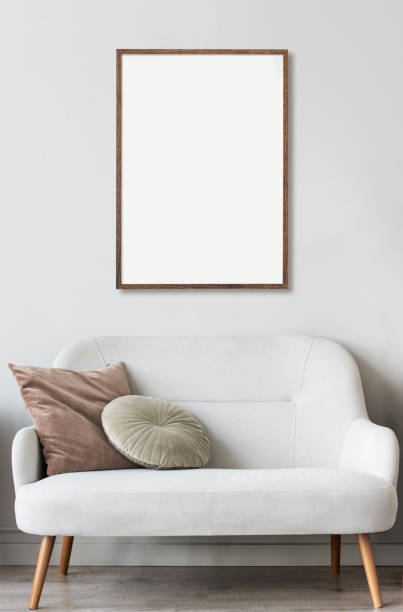 istock Artwork mock-up in interior design. Blank white picture frame on a gray wall 1343504245