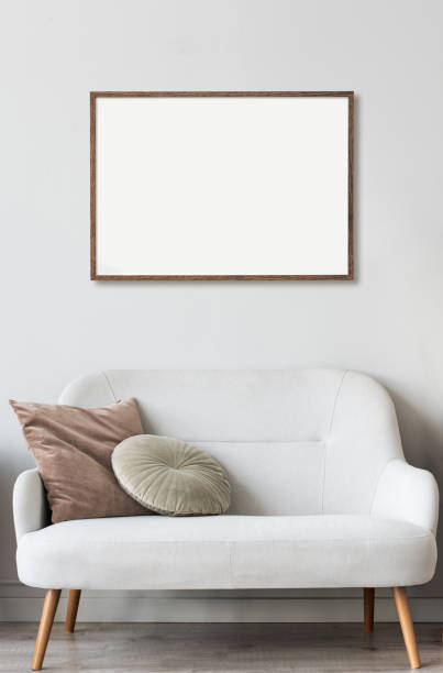 istock Artwork mock-up in interior design. Blank white picture frame on a gray wall 1343504246