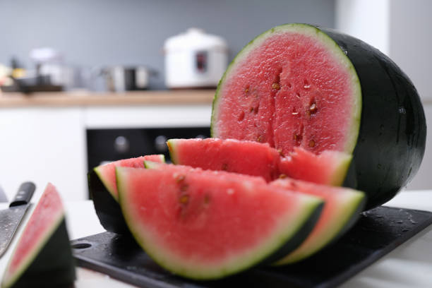 istock Large ripe juicy sliced watermelon on table closeup 1343505244